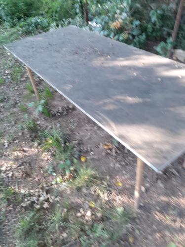 a ping pong table sitting in the grass at Cozy2 in Union