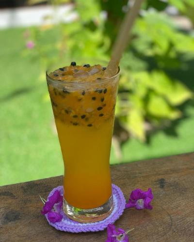 a drink sitting on top of a table at Bloom Garden Bed & Breakfast in Siem Reap