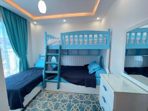 Postel nebo postele na pokoji v ubytování Sharm Hills Aqua park Resort شرم هيلز اكوا بارك ريزورت