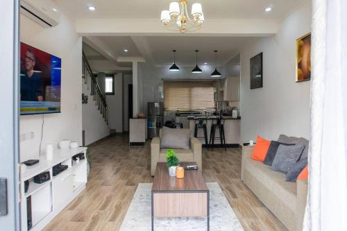 a living room with a couch and a table at Urban oasis in kingsland city in Lusaka