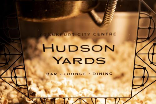 a picture of a box of hudson yards bar lounge dining at Hilton Frankfurt City Centre in Frankfurt/Main