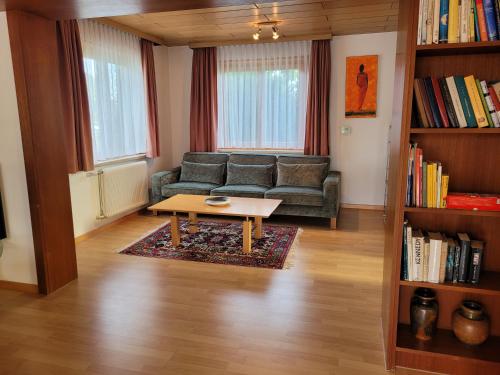 a living room with a couch and a coffee table at Ferienhaus Hämmerle´s in Lustenau