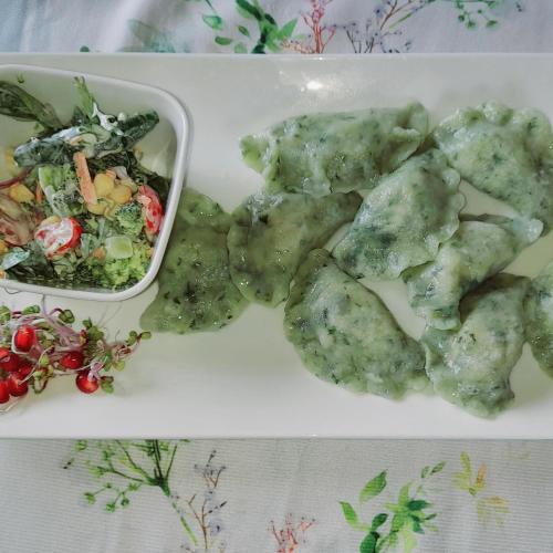 a white plate of food with a salad and meatballs at Gazdówka na Mosornym Groniu in Zawoja
