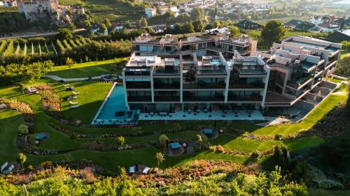 an aerial view of a large building with a garden at Boutique Hotel AMARIL in Castelbello-ciardes