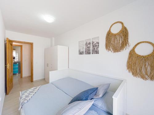 a room with a couch and two mirrors on the wall at Casa Eufor-b-ia, confort & relax, aircon in Morro del Jable