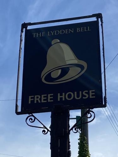 a free house sign hanging on a pole at The Lydden Bell in Dover