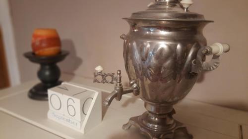 a silver blender on a table next to a box at The Old House in Malbork