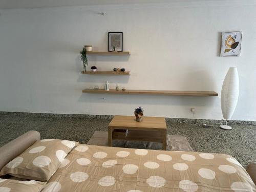 a living room with a bed and a coffee table at Charming 3-Bed Studio in Arrentela in Arrentela