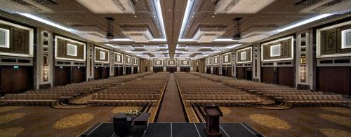 an empty room with rows of seats in a building at Hilton Istanbul Bomonti in Istanbul