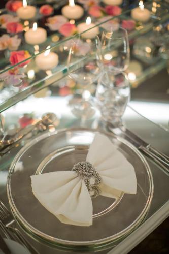 a table with a plate with a napkin on it at Hilton Istanbul Bomonti in Istanbul