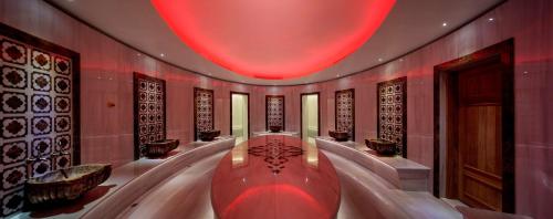 a large room with a red light on the ceiling at Hilton Istanbul Bomonti in Istanbul