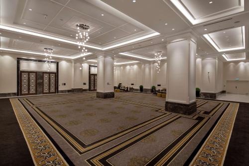 a large ballroom with a large room with columns at Hilton Istanbul Bomonti in Istanbul