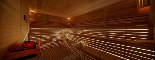 an empty sauna with wooden walls and wooden floors at Hilton Istanbul Bomonti in Istanbul
