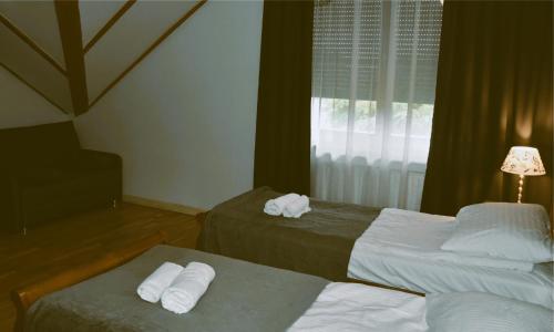 Postel nebo postele na pokoji v ubytování Hotel Gość w dom
