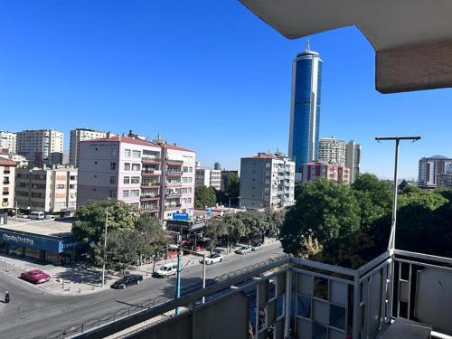 a view of a city street with a tall building at CAN REZİDANS in Konya