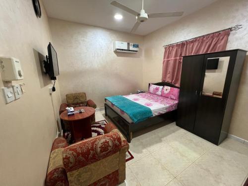 TV a/nebo společenská místnost v ubytování AL FANAR REST HOUSE LLC