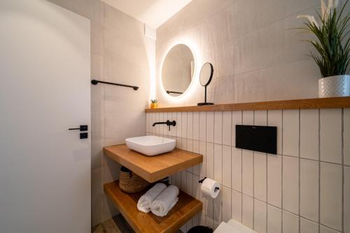 a bathroom with a sink and a mirror at Casa Galana in Tías