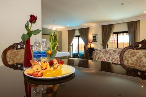 a plate of food on a table in a room at The Convention Center & Royal Suites Hotel in Kuwait