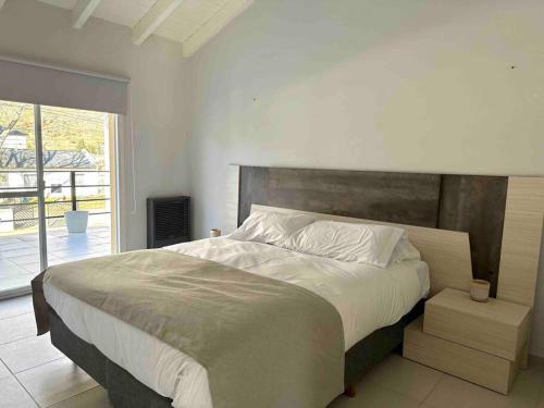 Ένα ή περισσότερα κρεβάτια σε δωμάτιο στο Casa de Cóndor