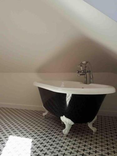 a black and white bath tub in a bathroom at The Sails in East Wittering