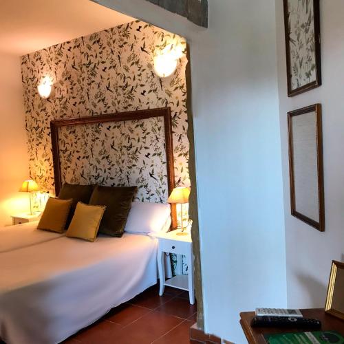Ένα ή περισσότερα κρεβάτια σε δωμάτιο στο LEON DORMIDO Rooms & Apartments