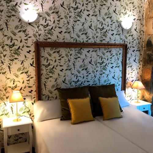 Ένα ή περισσότερα κρεβάτια σε δωμάτιο στο LEON DORMIDO Rooms & Apartments