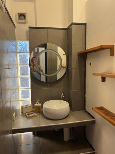 a bathroom with a sink and a mirror on a counter at Coeur de Marseille in Marseille