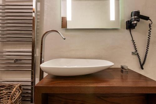 a white sink on a wooden counter in a bathroom at Mountain's Secret in Mouresi