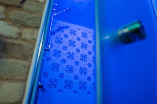 a blue door with a snowflake pattern on it at RhelizeOne & Spa جميل in Palermo