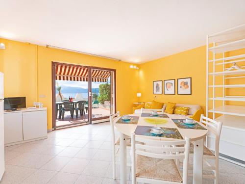 A television and/or entertainment centre at Apartment Turistica-1 by Interhome