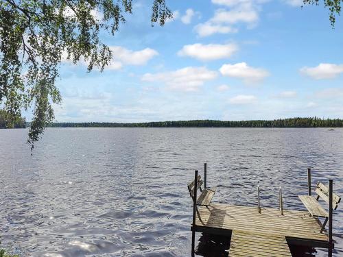 a wooden dock on a large body of water at Holiday Home Koivula by Interhome in Soini