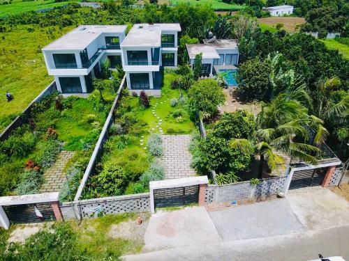 an aerial view of a house with a yard at Villa có hồ bơi riêng tại Lang Phuoc Hai 
