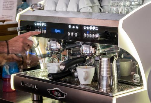 a coffeemaker with a coffee maker on top of it at Centro Hotel Ioannina in Ioannina