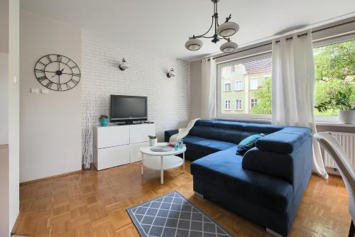 Televízia a/alebo spoločenská miestnosť v ubytovaní Apartament Dolina Poznań