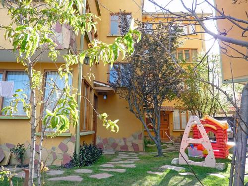 a playground in the yard of a building at Caserita in La Paz