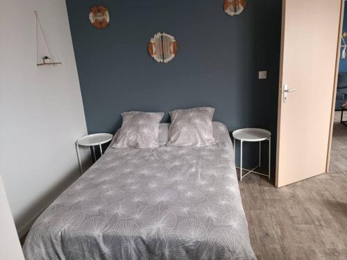 Ένα ή περισσότερα κρεβάτια σε δωμάτιο στο Charmante maison tout confort