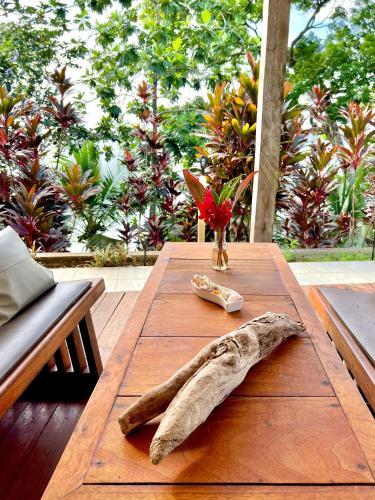 a wooden table with a large animal fossil on it at Akwaba Lodge in The Gap