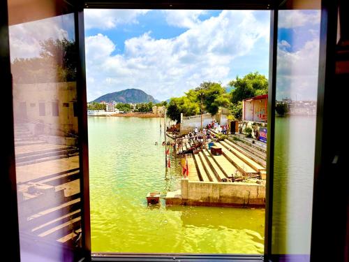 a view from a window of a body of water at Hotel Kota kunj Heritage in Pushkar