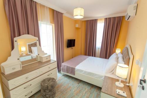 Postel nebo postele na pokoji v ubytování Roses Villa
