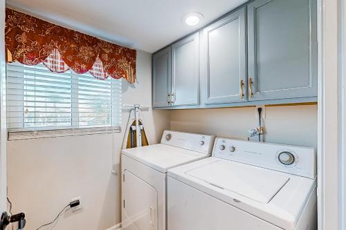 a laundry room with a washer and dryer at Surf Dweller 203 in Fort Walton Beach