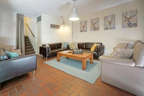 a living room with two couches and a coffee table at Domaine Long Pre in Stavelot