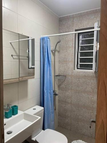 a bathroom with a shower and a toilet and a sink at Anastasia’s Home in Chania
