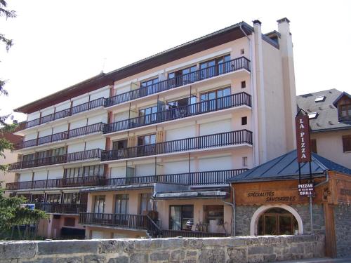 a large building with balconies on the side of it at Studio Valloire, 1 pièce, 4 personnes - FR-1-263-57 in Valloire