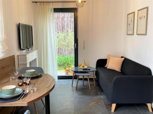 a living room with a couch and a table at Apartment Joel by Interhome in Stockach