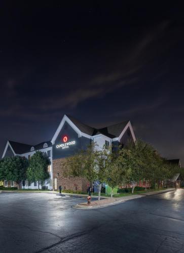 a building with a sign on it at night at Candlewood Suites Eagan - Mall of America Area by IHG in Eagan