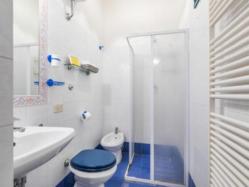 a bathroom with a toilet and a sink and a shower at Holiday Home Ridaldi by Interhome in Greve in Chianti
