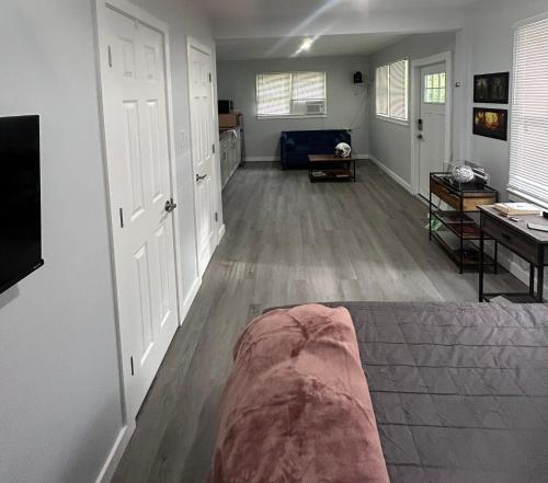 a living room with a couch in the middle of a room at The Oasis in Sanford