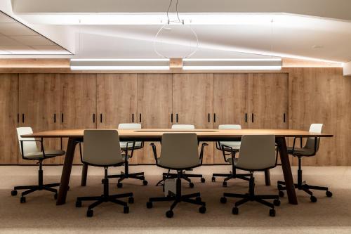 a conference room with a large wooden table and chairs at BizStay Walden in The Hague