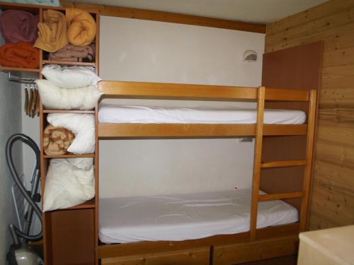 a group of bunk beds in a room at Appartement Les Adrets-Prapoutel, 2 pièces, 4 personnes - FR-1-557-8 in Les Adrets