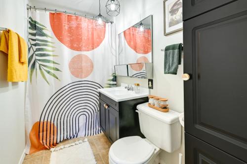 a bathroom with a toilet and a shower curtain at Cozy Montello Hideaway Near Puckaway Lake Access! in Montello